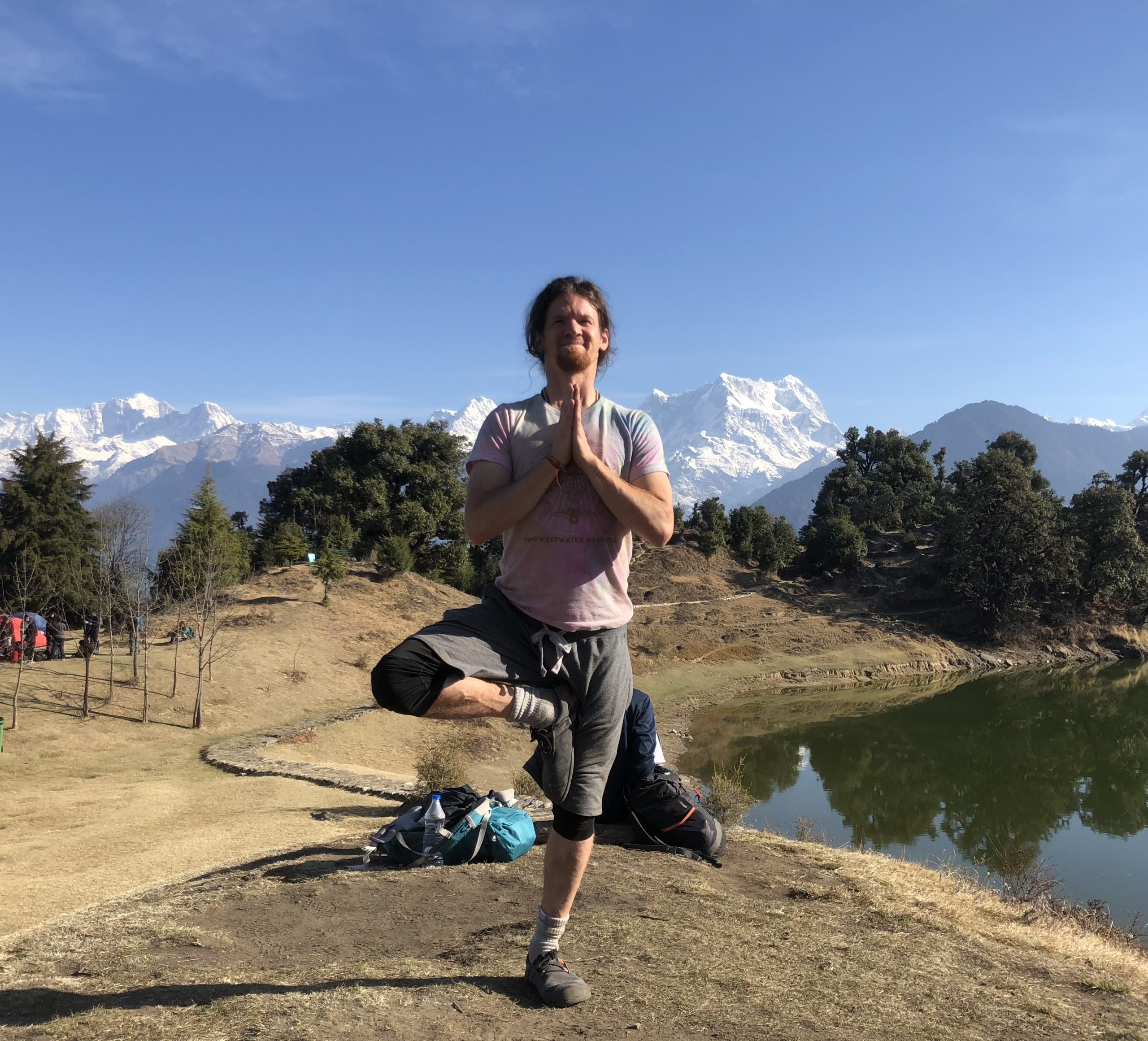 Yoga instructor joe in front of mountains. 