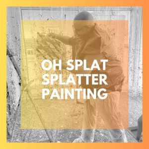 customer showing off their splatter painting with orange and yellow overlay