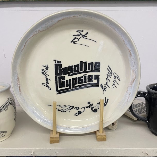 white ceramic plate with gasoline gypsies logo and signatures