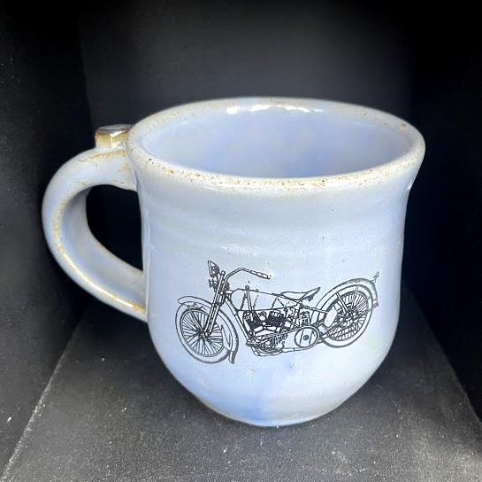 pale blue mug with motorcycle decal