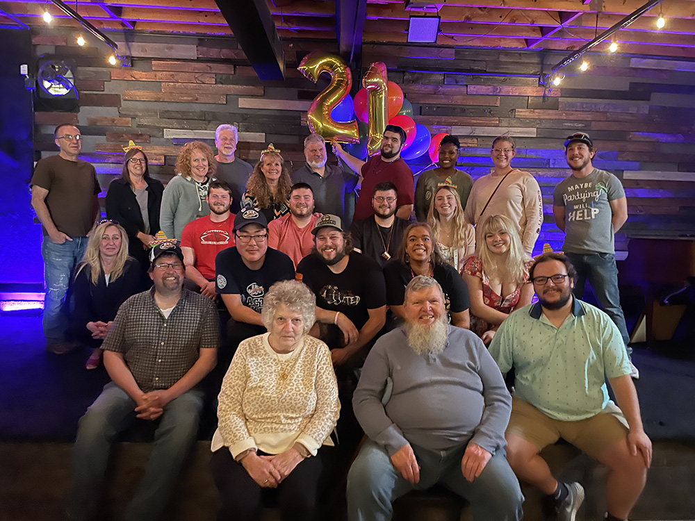 group of family celebrating a 21st birthday with a game show at Foundry in Port Huron